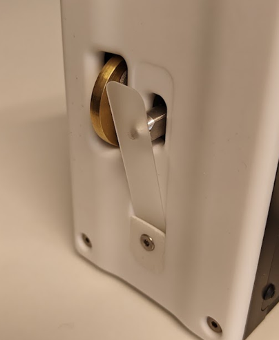 Bottom view of the Tapio RQP Live showing the distance measurement wheel and hardness measurement hammer used for fast paper hardness measurements.