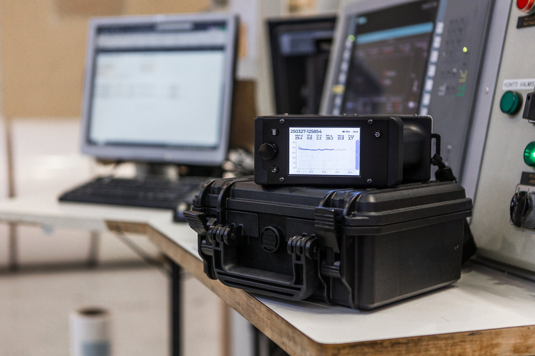 Tapio RQP Live handheld roll hardness profiler resting on its rugged carrying case.